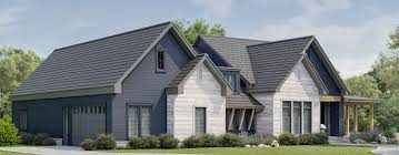 two-story home with navy and white siding, a gray roof and attached garage
